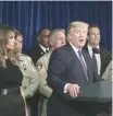  ?? —Reuters ?? US President Trump speaks with police in Las Vegas.