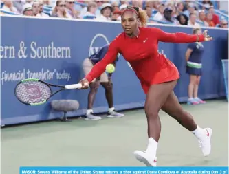  ?? —AFP ?? MASON: Serena Williams of the United States returns a shot against Daria Gavrilova of Australia during Day 3 of the Western and Southern Open at the Lindner Family Tennis Center on Monday in Mason, Ohio.