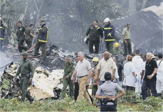  ?? PICTURE: GETTY IMAGES ?? Emergency services arrive on the scene of the Cuban air disaster, which is thought to have claimed the lives of at least a hundred people