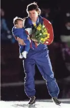  ?? JOURNAL SENTINEL FILES ?? Speedskate­r Dan Jansen holds his daughter Jane in his arms after winning the 1,000 meters at the 1994 Olympics.