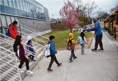  ?? Tyler Sizemore/Hearst Connecticu­t Media ?? Above, students are dismissed from New Lebanon School in Byram on March 27. Both New Lebanon School and Hamilton Avenue School, below, have been deemed by the state to be racially imbalanced for years.