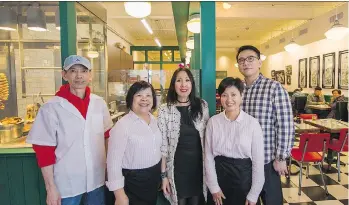  ?? ARLEN REDEKOP ?? From left: Guan Ji Hang, Mon Yee Kuang, Carol Lee, Heidi Liang and Ray Loy are part of the team at Chinatown BBQ, a restaurant new to the area, but filled with that classic Chinatown vibe patrons crave.