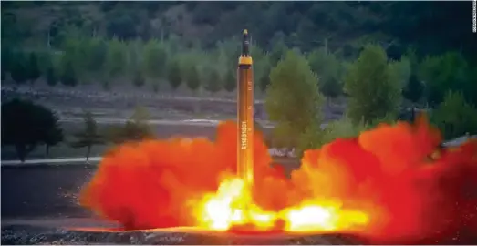  ??  ?? Test-launch of long-range strategic ballistic rocket Hwasong-12 (Mars-12) by North Korea in May 2017. (KCNA / Reuters)