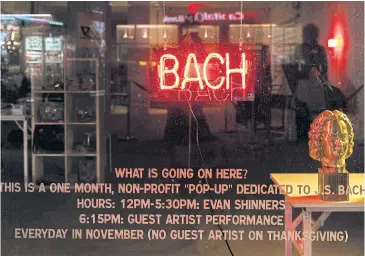  ?? PHOTOS BY THE NEW YORK TIMES ?? A neon sign in the window of a pop-up shop called the Bach Store in Manhattan.