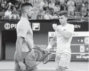  ?? JAYNE KAMIN-ONCEA USA TODAY Network ?? Novak Djokovic, left, and Luca Nardi pass each other while changing sides Monday in the BNP Paribas Open.