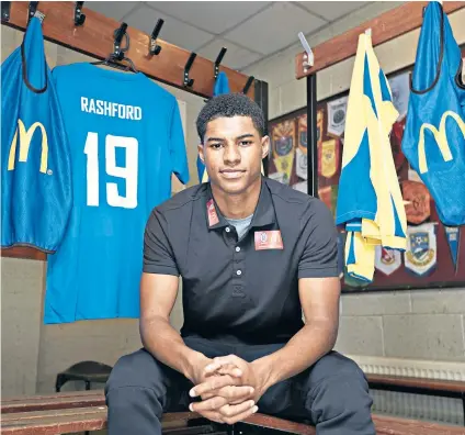  ??  ?? Grassroots visit: United striker Marcus Rashford back in the dressing room of his youth team, Fletcher Moss Rangers