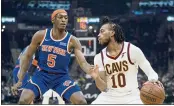  ?? TONY DEJAK — THE ASSOCIATED PRESS ?? The Cavaliers’ Darius Garland (10) drives against the Knicks’ Immanuel Quickley (5) in the first half Monday.