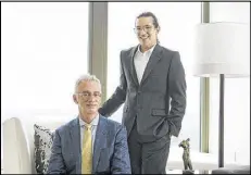  ??  ?? Robert Grayson and Andrew Harris (standing) had known each other for more than ten years before they decided to join forces and start GraysonHar­ris Interiors.