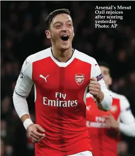  ??  ?? Arsenal’s Mesut Ozil rejoices after scoring yesterday Photo: AP