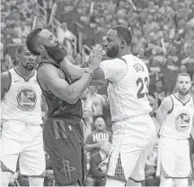  ?? Brett Coomer / Houston Chronicle ?? Warriors forward Draymond Green, right, gets aggressive with Rockets guard James Harden during the first half Monday.