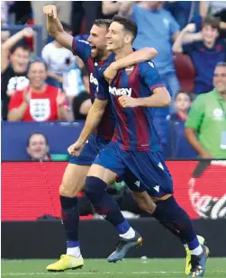  ?? — AP ?? Levante’s Nemanja Radoja (right) celebrates with and Borja Mayoral after scoring against Barcelona in their La Liga match in Valencia on Saturday.