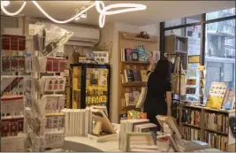  ?? LAM YIK FEI — THE NEW YORK TIMES ?? The Nowhere bookstore in Taipei, Taiwan, owned by Anne Jieping Zhang, a Nieman fellow at the Harvard Kennedy School, Feb. 21. From Thailand to the United States, Chinese denied a safe public space for discussion in their home country have found hope in diaspora communitie­s.