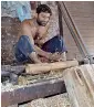  ?? APP ?? A carpenter is working at his furniture shop in Multan on Tuesday. —