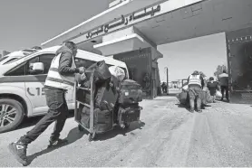  ?? ?? “Here from this crossing, we see the heartbreak and heartlessn­ess of it all. A long line of blocked relief trucks on one side of the gates, the long shadow of starvation on the other,” United Nations Secretary-General Antonio Guterres said Saturday at the Rafah border crossing between Egypt and the Gaza Strip. “That is more than tragic. It is a moral outrage.”