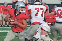  ?? Jeremy Stewart ?? Cedartown quarterbac­k Drew Ledbetter steps back in the pocket during the 2023 Red and White Game at Cedartown Memorial Stadium on Friday, May 19.