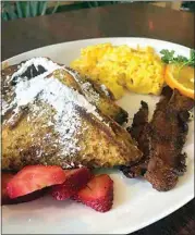  ?? COURTESY OF THE GLITZ CAFE ?? The French delight at The Glitz Cafe comes with two slices of thick-cut French toast, two eggs and choice of applewood bacon or sausages.