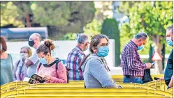  ?? BLOOMBERG ?? People wait in line to enter a vaccinatio­n centre in Barcelona, Spain.