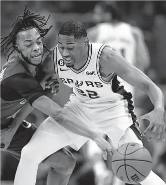  ?? Ron Schwane/associated Press ?? Darius Garland, left, has seen the Cavaliers go from the bottom of the NBA standings to playoff contention in a short time, an example Malaki Branham and the young Spurs are keen to follow.