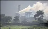  ?? ALTAF QADRI — THE ASSOCIATED PRESS ?? Smoke rises from a coal-powered steel plant at Hehal village near Ranchi in the eastern state of Jharkhand on Sunday.