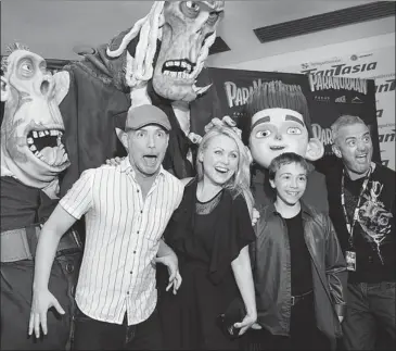  ?? MARIE-FRANCE COALLIER/ THE GAZETTE ?? Director Sam Fell, right, and writer-director Chris Butler flank Mitsou Gélinas and Émilien Néron — who provide character voices in the French version of ParaNorman — after walking the red carpet at film’s premiere in Montreal.