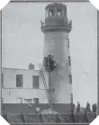  ??  ?? The effect of the shell which tore this hole in the lighthouse was so destructiv­e that the structure was condemned as unsafe.