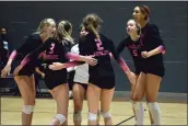  ?? ?? Members of Absolute Volleyball Club's 17Black team huddle after a point at the Girls Junior National Championsh­ip at Chicago's McCormick Place on Thursday. The tournament brought Marin and Bay Area talent to a national stage.