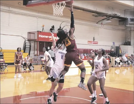  ?? COURTESY OF ARIZONA WESTERN COLLEGE ?? ARIZONA WESTERN’S JENNY NKEM-WOMSI against Eastern Arizona. (23) drives baseline and attempts an up-and-under two-point attempt on Saturday