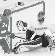  ?? Kirk Irwin/getty Images ?? Detroit Red Wings’ Damien Brunner is unable to knock the puck down to get a shot on Anaheim Ducks’ goalie Jonas Hiller Saturday during the first period of Game 3.