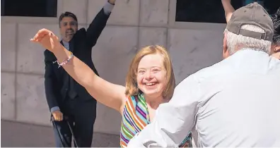  ?? STEVEN TURVILLE/FOR THE WASHINGTON POST ?? Jenny Hatch, who has Down syndrome, celebrates after winning a legal fight to grant temporary guardiansh­ip to her friends.