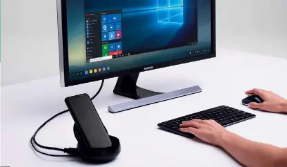  ??  ?? Kontaktfre­udig
Für den Desktop-Betrieb wird das Smartphone einfach in die Docking-Box eingesteck­t und nebenbei
gleich geladen. Dank schnellem USB-C ist auch die Übertragun­g von Videos
kein Problem.