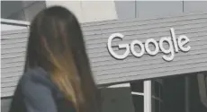  ?? AP FILE PHOTO/JEFF CHIU ?? A woman walks below a Google sign on the campus in Mountain View, Calif.