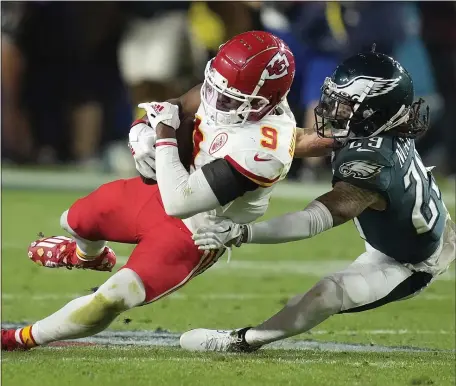  ?? ASHLEY LANDIS — THE ASSOCIATED PRESS ?? Kansas City Chiefs wide receiver JuJu Smith-Schuster (9) falls to the turf against Philadelph­ia Eagles cornerback Avonte Maddox during the second half of the Super Bowl last month in Glendale, Ariz.