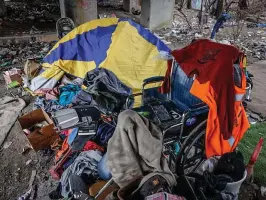  ?? JIM NOELKER/STAFF ?? A large homeless encampment is located on East Monument Avenue under the railroad trestle near Dragon Auto Sales. The 2023 Montgomery County Point-in-Time Count of homelessne­ss included 790 people, 106 of whom were unsheltere­d.