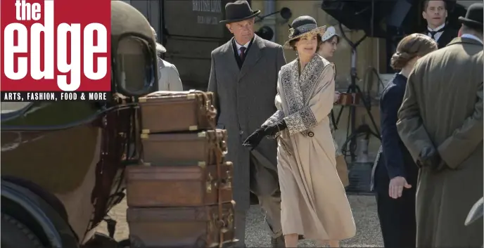  ?? FOCUS FEATURES ?? OFF TO FRANCE: Robert Crawley (Hugh Bonneville, left) and his wife Cora (Elizabeth McGovern) depart Downton Abbey for the south of France as a film crew takes over the manor.