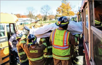  ?? SUBMITTED PHOTO ?? A “crash victim” is removed from a school bus during training by the Norco Fire Company.