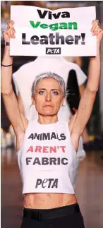  ?? ?? Protest: A Peta activist storms on to the catwalk in Paris last night