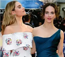  ??  ?? Double trouble: Lily James and Jessica Brown Findlay