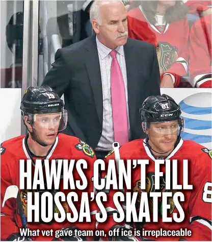  ?? | JONATHAN DANIEL/ GETTY IMAGES ?? Coach Joel Quennevill­e said the Hawks “got a little spoiled over the years” with Marian Hossa ( right).