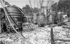  ??  ?? Wine vats from Paradise Ridge Vineyards and Winery burned by wildfires are seen in Santa Rosa, California, on Oct 12, 2017.