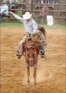  ?? MARK HUMPHREY ENTERPRISE-LEADER ?? Travis Gardner scored 78 points during this bronc ride Thursday to win the overall saddle bronc competitio­n during the 66th annual Lincoln Rodeo.