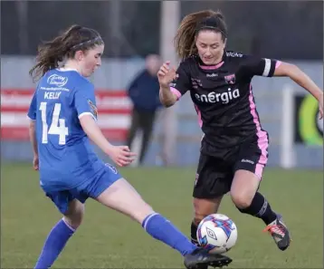  ??  ?? Kylie Murphy slips the ball beyond Claire Kelly of Limerick F.C.