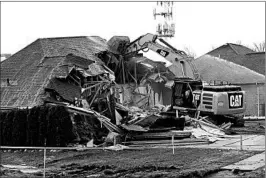  ?? CLARENCE TABB JR./DETROIT NEWS 2017 ?? A house in Fraser, Mich. is demolished to help clear the way for repairs to a broken sewer line. Officials say Fraser’s infrastruc­ture needs could hold back economic growth.