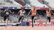  ?? AP ?? Ronnie Baker (left), of the United States, crosses the finish line to win the men’s 100 metres in 9.90 seconds at the London Diamond League meet yesterday. Zharnel Hughes (second right), of Britain, was second in 9.93 while third went to Akani Simbine (right), of South Africa, in 9.94. Jamaica’s Yohan Blake (second left) was fourth in 9.95.