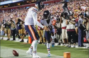  ?? The Associated Press ?? END ZONE CELEBRATIO­N: Chicago Bears quarterbac­k Mitchell Trubisky, left, celebrates after connecting with wide receiver Taylor Gabriel (18) for a touchdown during the first half of Monday’s game against the Washington Redskins in Landover, Md.