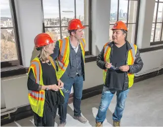  ?? MIKE DREW ?? Michele Stanners, from left, executive director of The Making Treaty 7 Cultural Society, Reid Henry, president and CEO of cSPACE Projects and Troy Emery Twigg, the cultural society’s artistic director, tour the renovated King Edward School in Calgary...