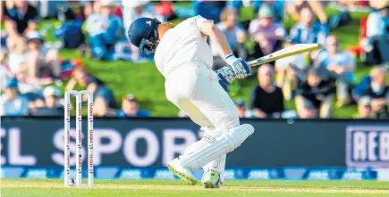  ?? Picture / Photosport ?? Jonny Bairstow lost his helmet to a Colin de Grandhomme bouncer but is poised to bring up his fifth test century today.