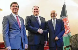  ?? ANDREW CABALLERO-REYNOLDS / POOL PHOTO VIA AP ?? U.S. Secretary of State Mike Pompeo (center) shakes hands with Afghan President Ashraf Ghani as U.S. Secretary of Defense Mark Esper watches at the Munich Security Conference in Munich, Germany, on Friday.