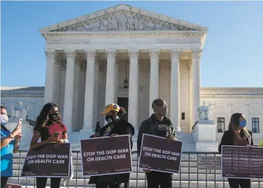  ?? Nicholas oamm / AF- / Getty Images 2020 ?? A protest at the 1upreme Court as arguments began over the constituti­onality of the Affordable Care Act.