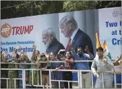  ??  ?? People line the street as the motorcade for President Donald Trump heads to a “Namaste Trump” event in Ahmedabad, India.