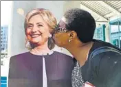  ?? AFP ?? A supporter kisses a cardboard cutout of Democratic presidenti­al nominee Hillary Clinton in Los Angeles, California.